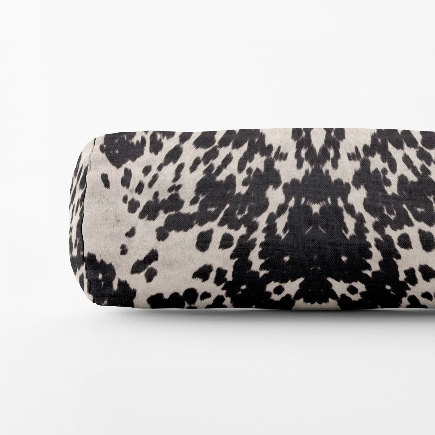 Black and white patterned cylindrical object on a white background